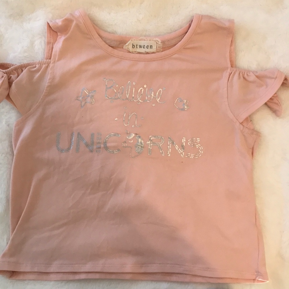 Pink top with silver words